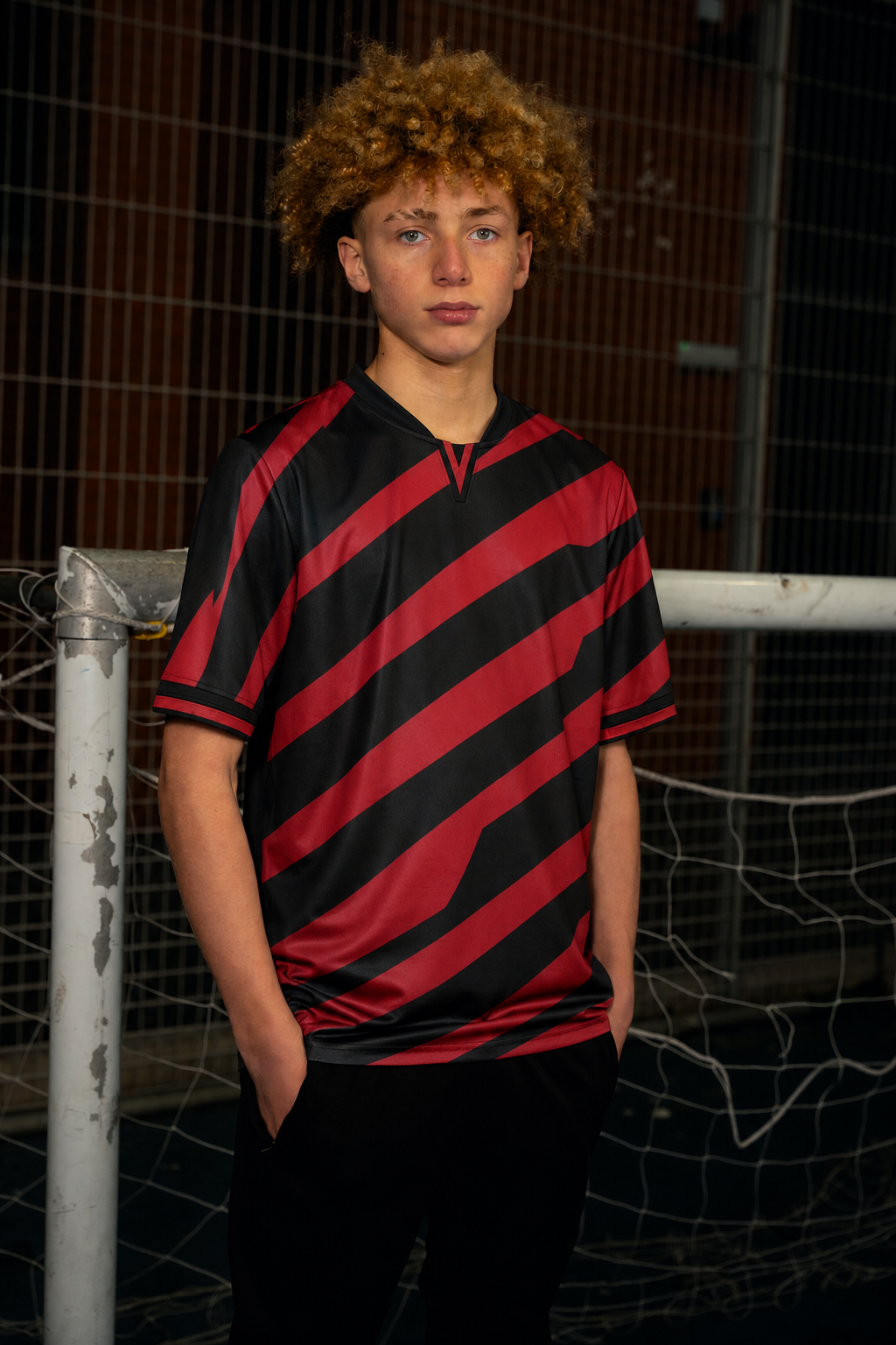 Design visualisation of a model wearing the stepped stripe shirt in red / black